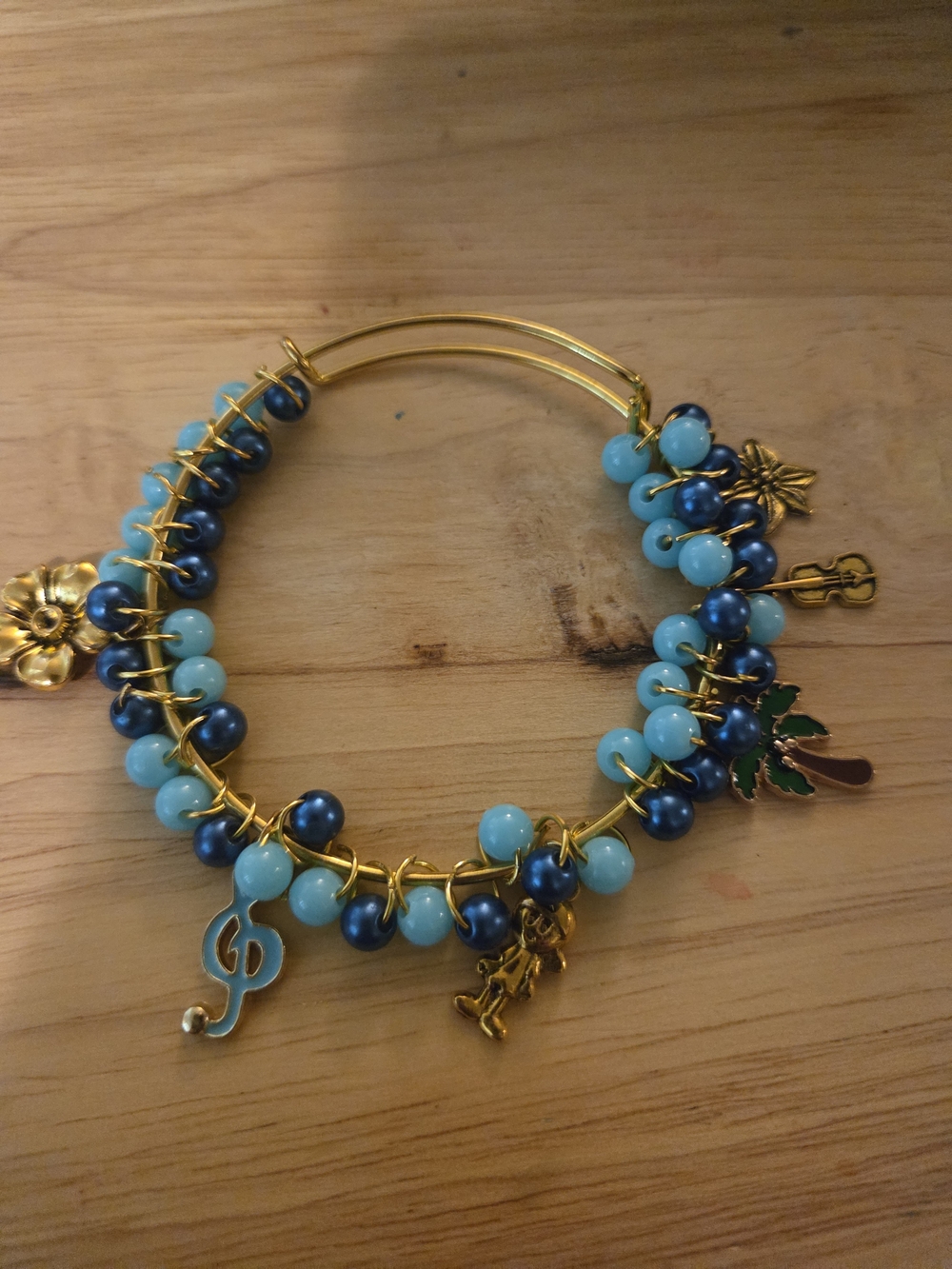 Gold-Tone Bracelet with Blue and Turquoise Beads and Charms